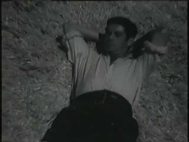 Secuencia de la película "Condenados" (1953) dirigida por Manuel Mur Oti e interpretada por Aurora Bautista y José Suárez en donde aparece el Cerro de la Atalaya y segadores guardiolos